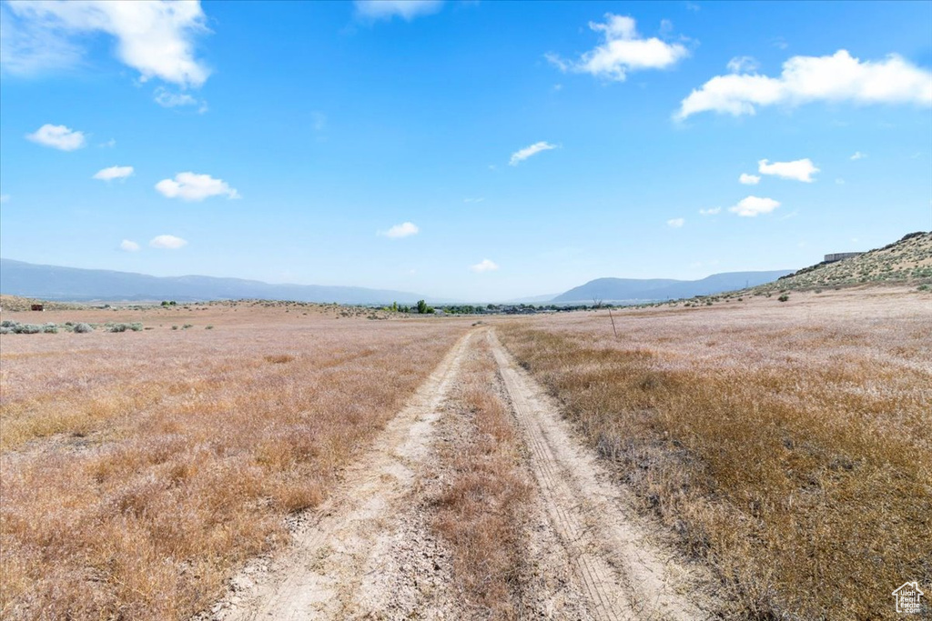 View of mountain background featuring rural landscape