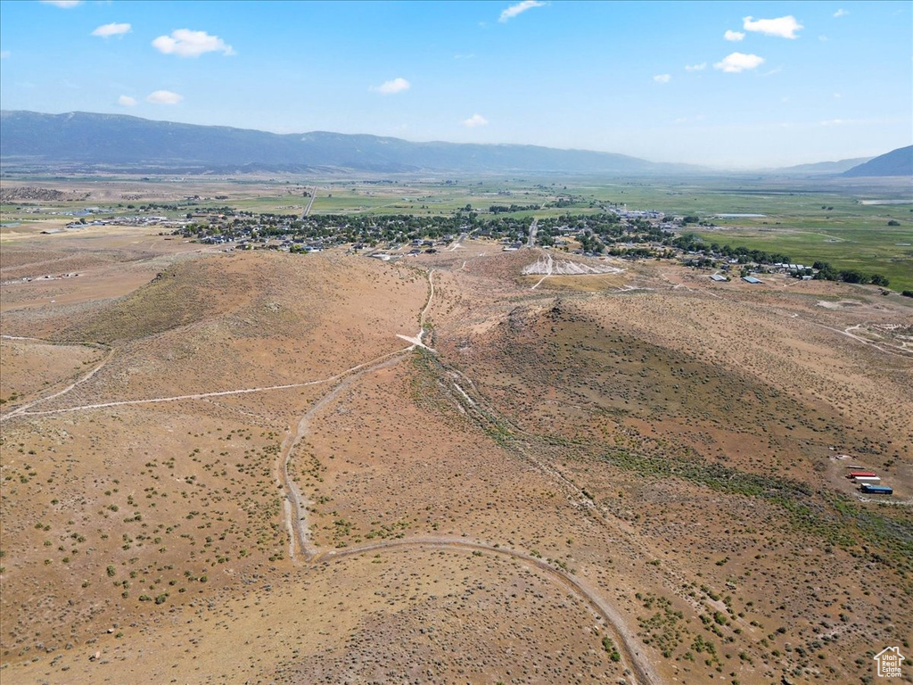 Overview of rural landscape with a mountain backdrop