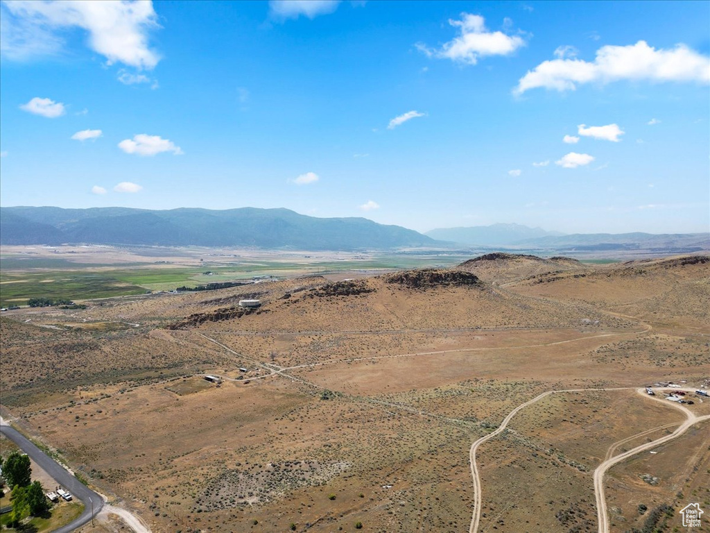View of mountain background featuring rural landscape