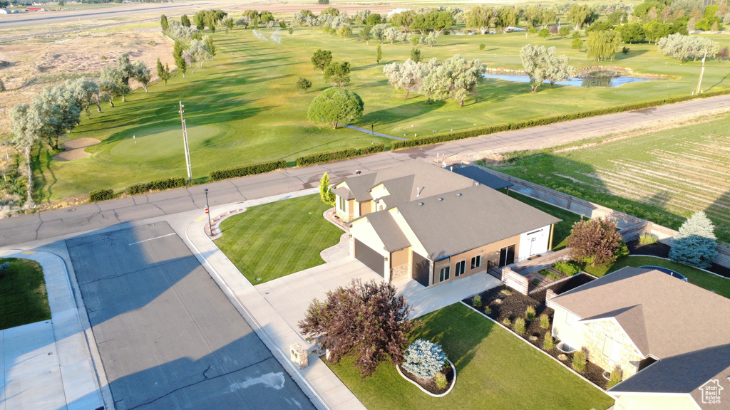 Bird\\\'s eye view of a nearby body of water and a golf club