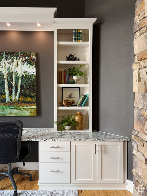 Office featuring light wood-style flooring and baseboards