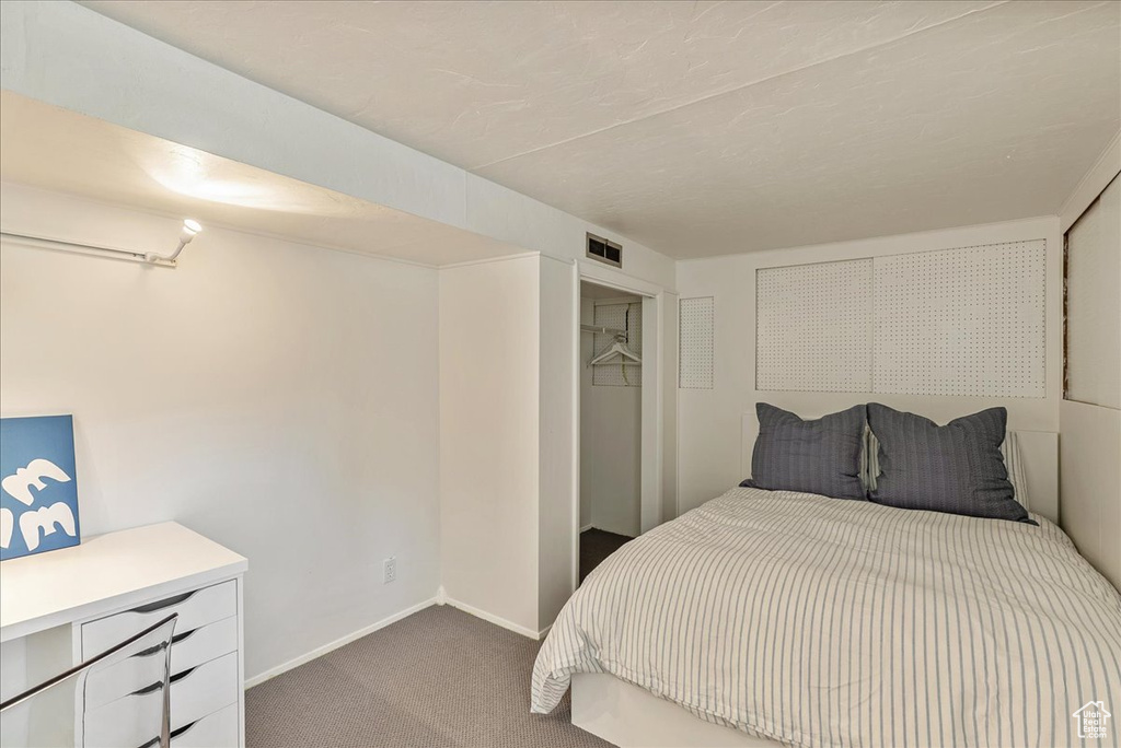 Bedroom with carpet and baseboards