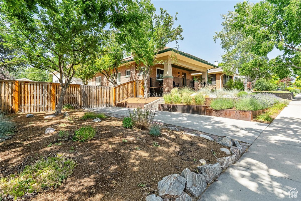 View of yard featuring covered porch