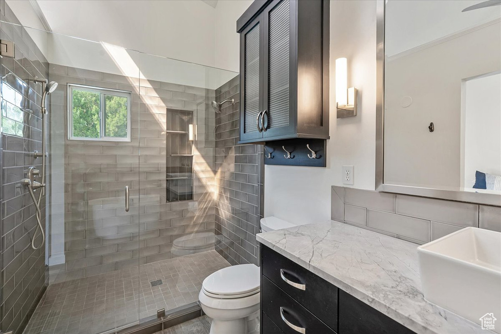 Bathroom with a stall shower and vanity