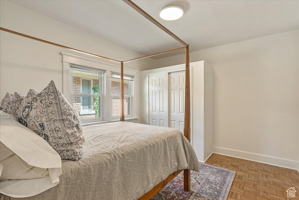 Bedroom with baseboards and a closet
