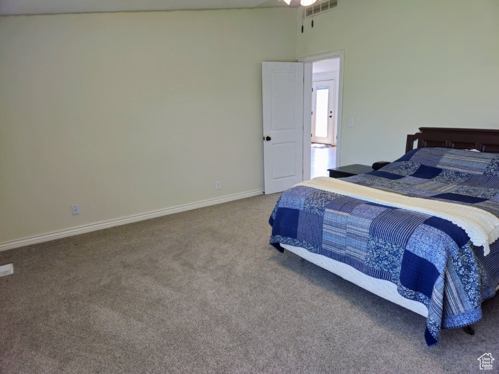 Bedroom with carpet flooring and baseboards