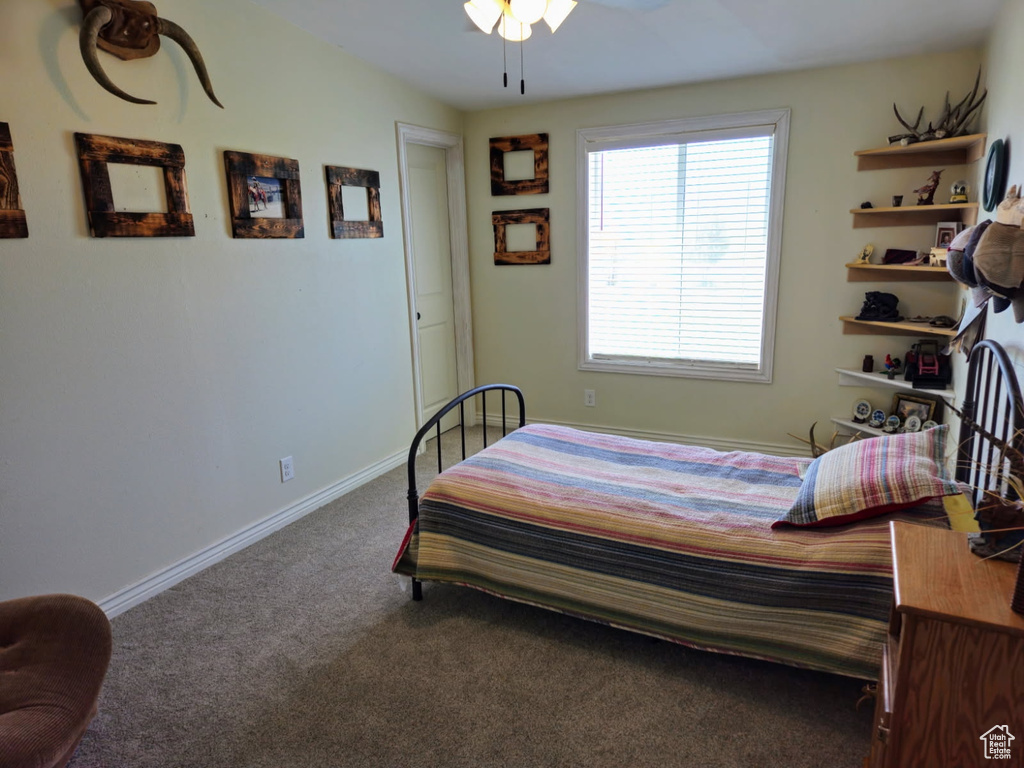 Carpeted bedroom with baseboards