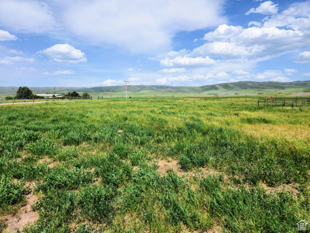 View of yard featuring a view of countryside and a mountain view