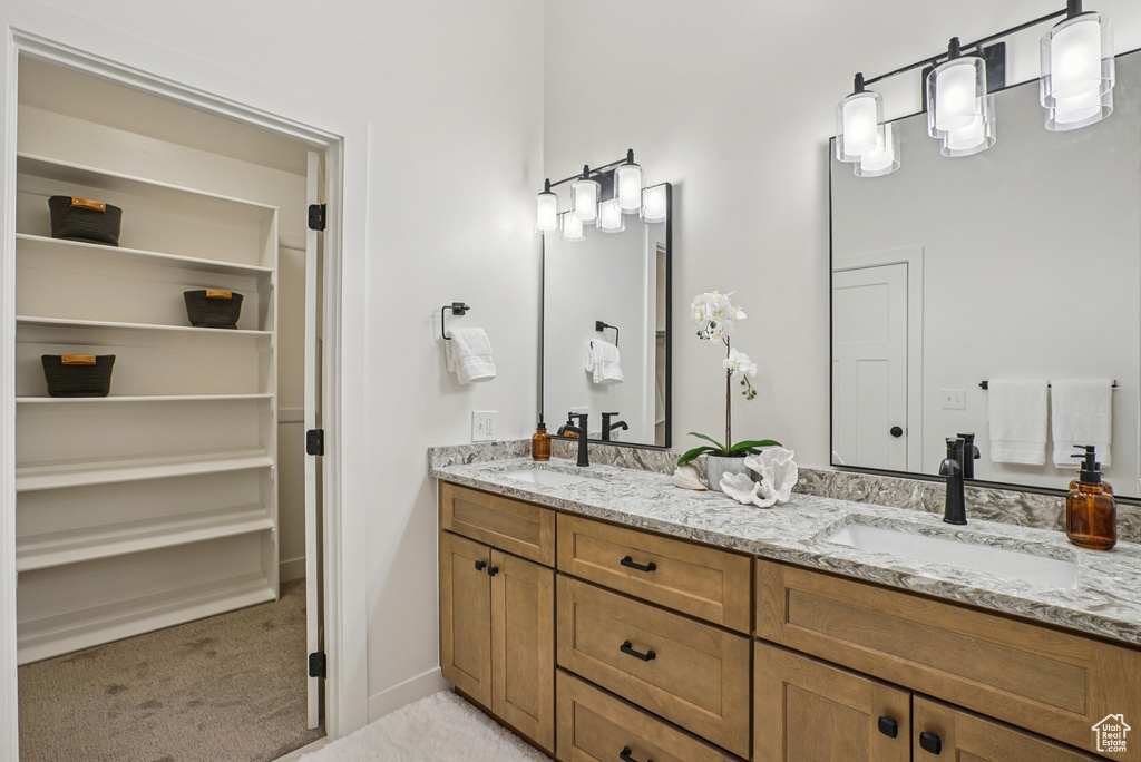 Bathroom featuring double vanity