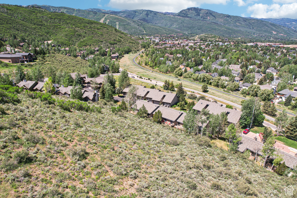 Aerial view of residential area featuring a mountain backdrop