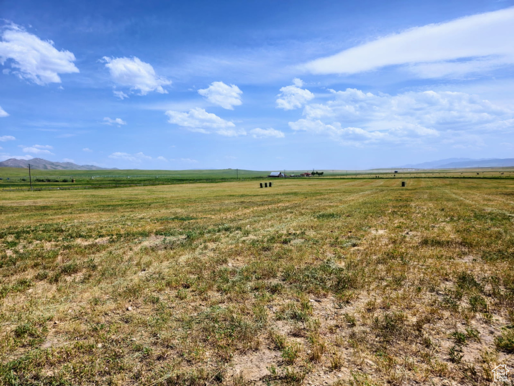 View of yard with a view of rural / pastoral area and a mountain view