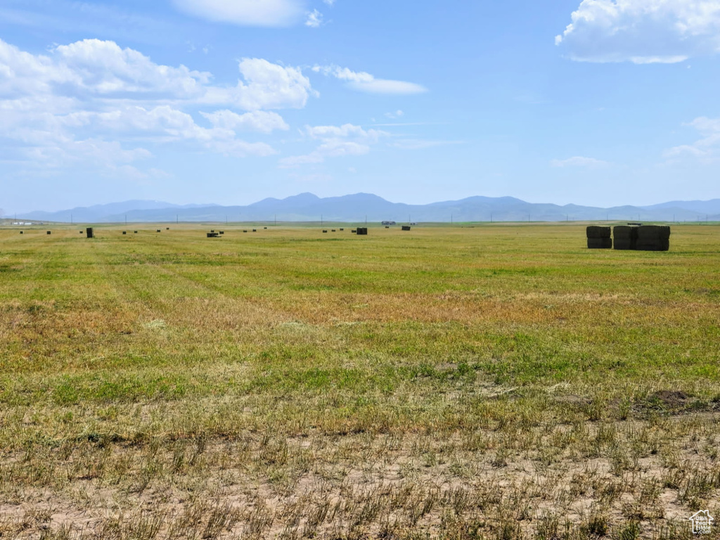 View of mountain background featuring rural landscape