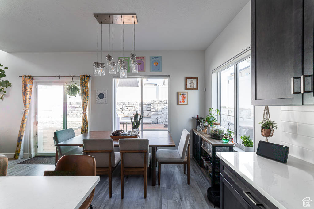 Dining room featuring wood finished floors and baseboards