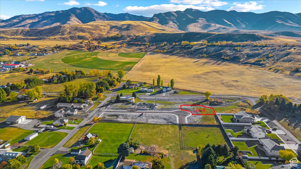 Aerial overview of property\'s location with mountains and property parcel outlined