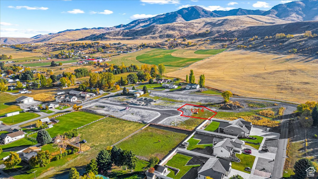 View of property location with a mountainous background and property boundaries highlighted