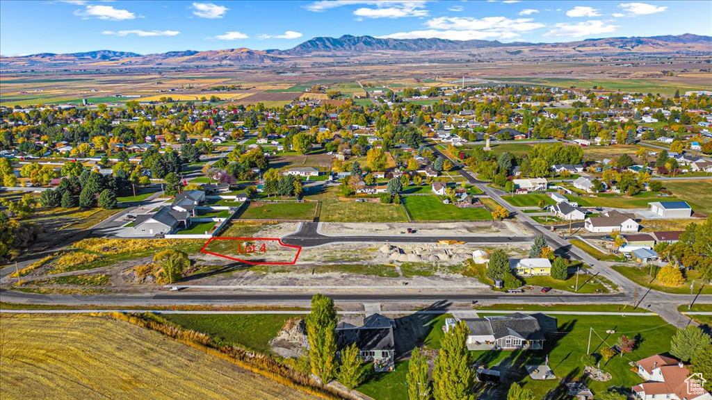 View of property location featuring a mountain backdrop and nearby suburban area