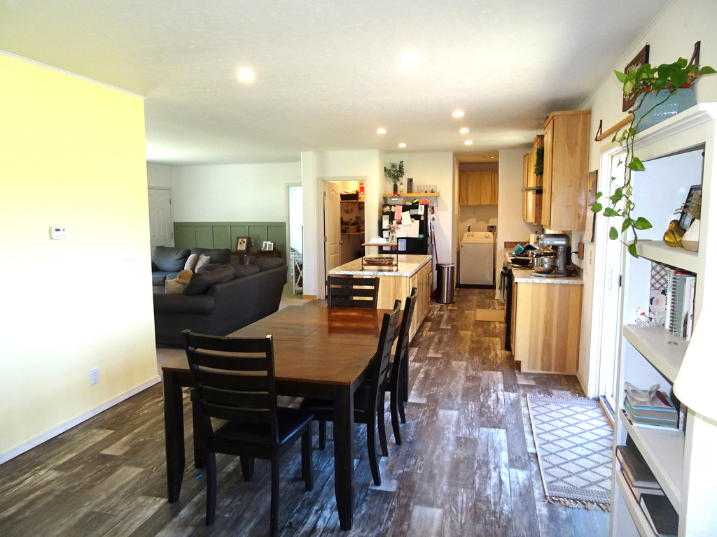 Dining area featuring washer / clothes dryer, dark wood-style floors, and recessed lighting