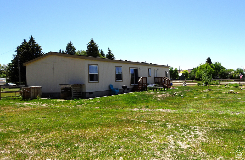 Back of house with crawl space