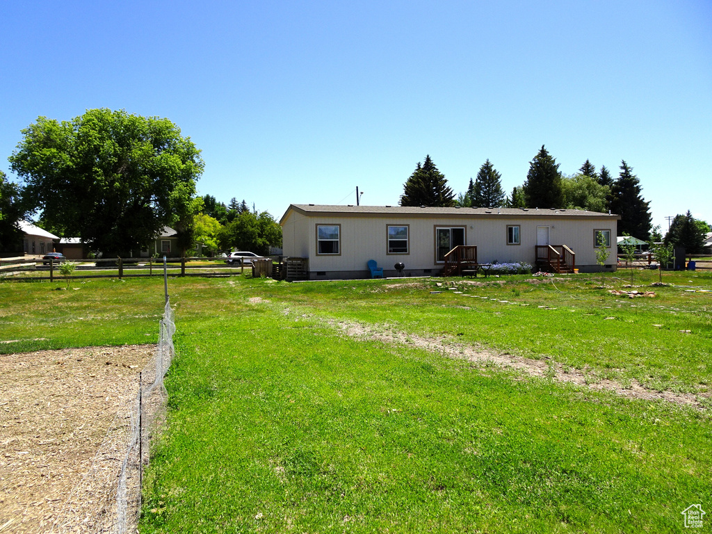 Back of house with crawl space
