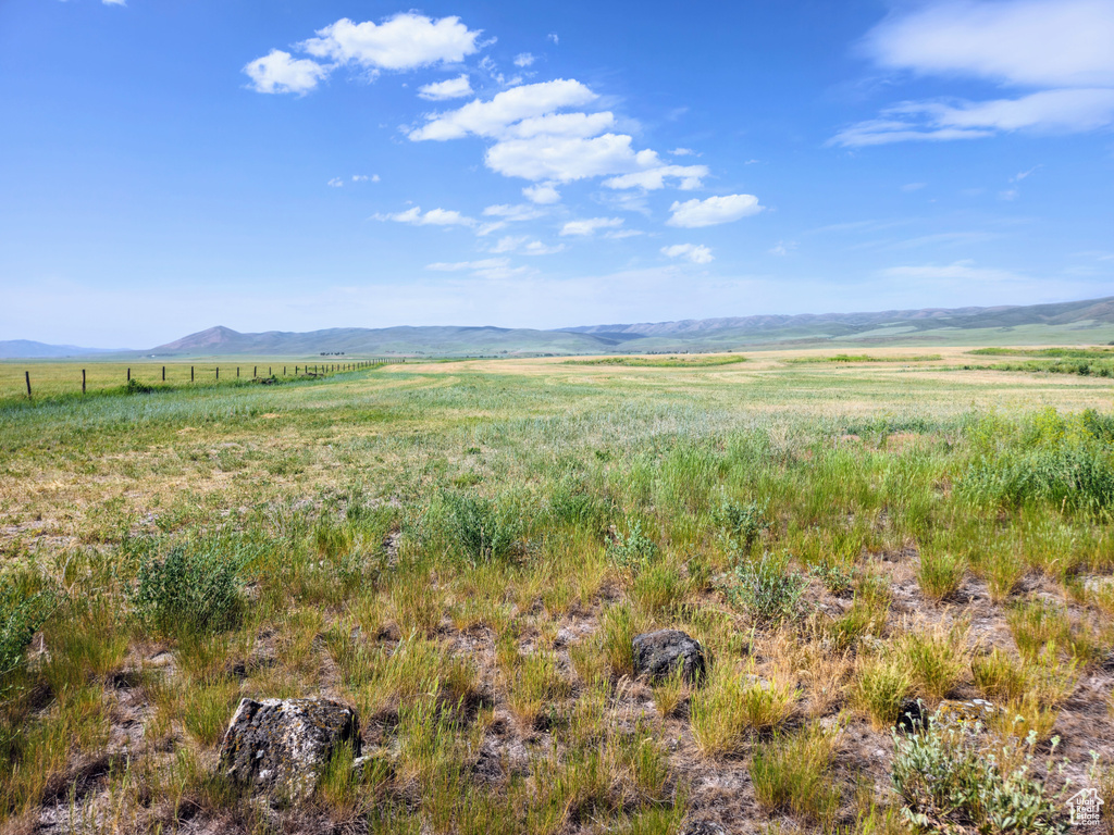 View of mountain backdrop featuring rural landscape