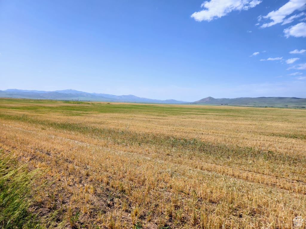 View of mountain background featuring rural landscape