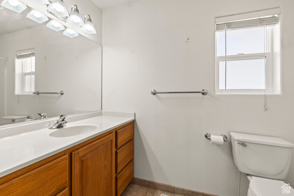 Bathroom with vanity and tile patterned flooring