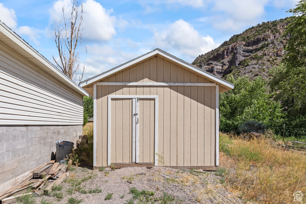 View of shed with a mountain view