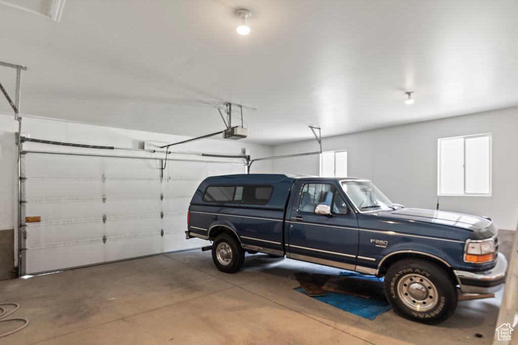 Garage featuring a garage door opener