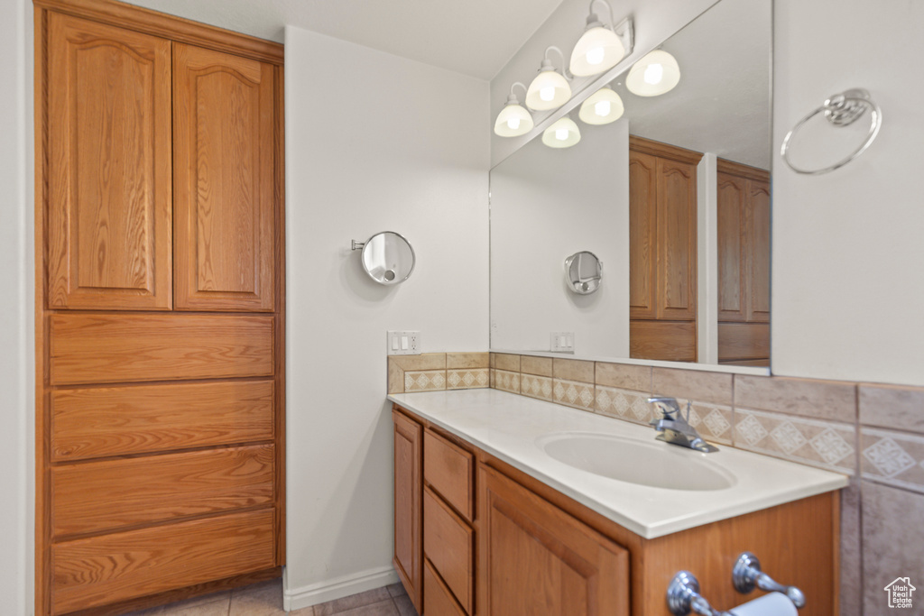 Bathroom with vanity and tile patterned flooring