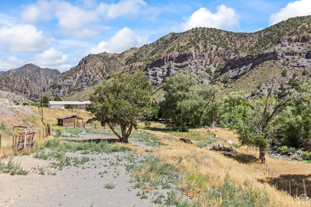 View of mountain background featuring rural landscape
