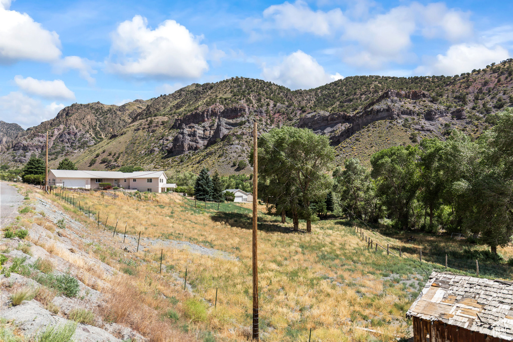 View of mountain backdrop featuring rural landscape