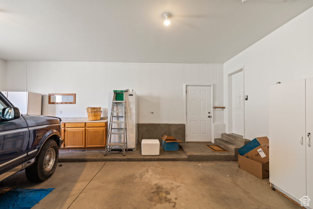 Garage featuring fridge