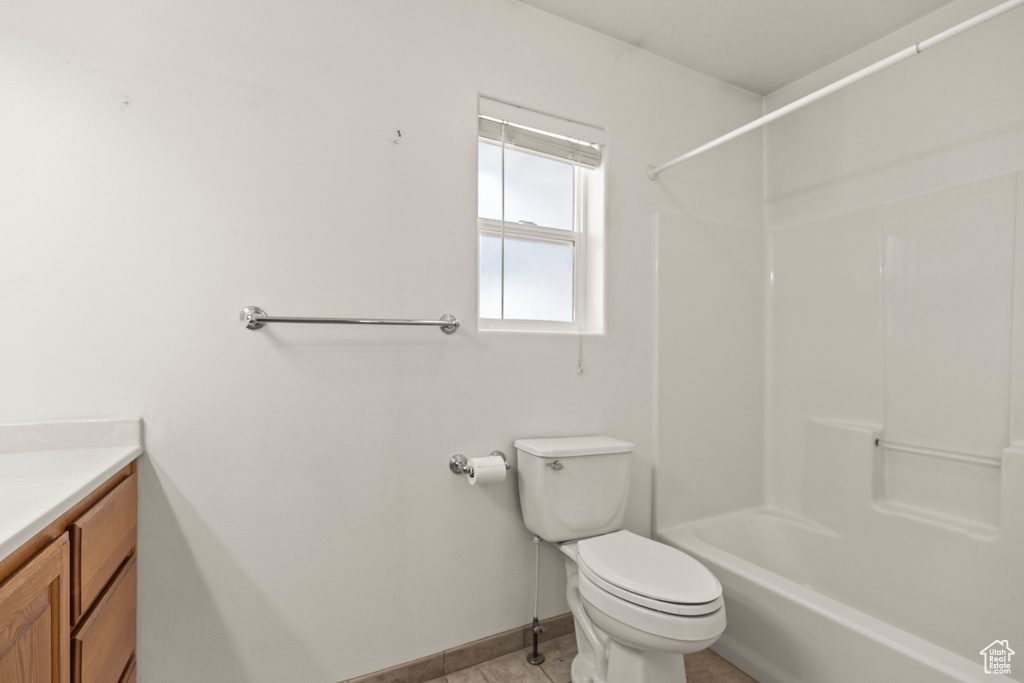 Full bath featuring vanity and shower / washtub combination