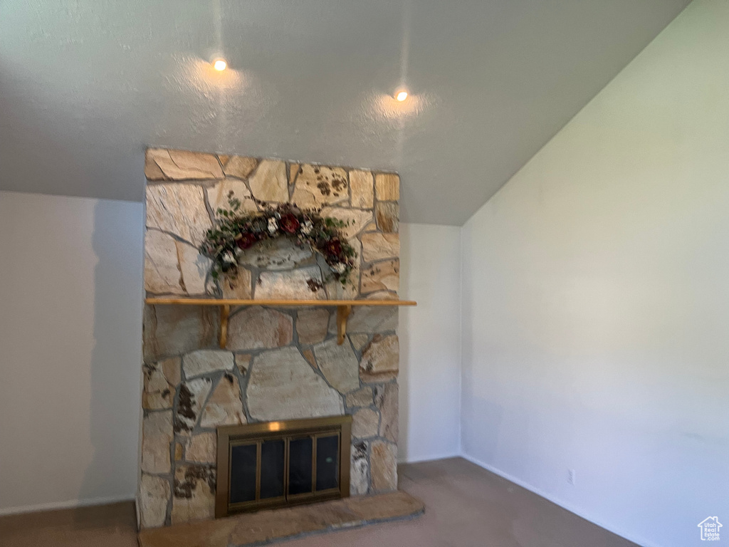 Detailed view of a fireplace and baseboards