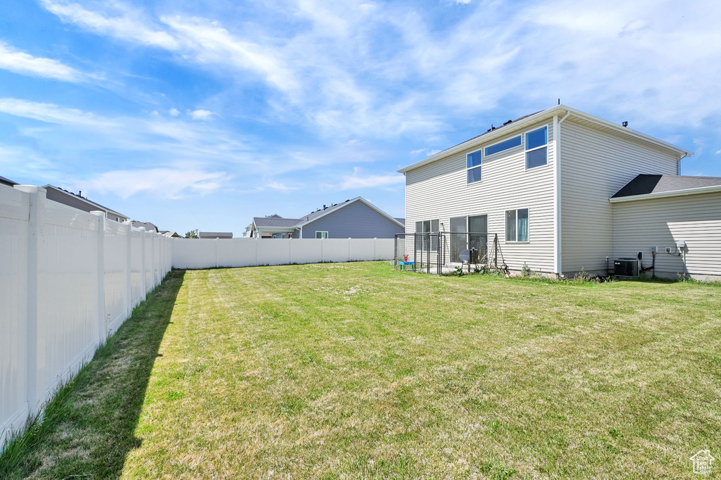 View of fenced backyard