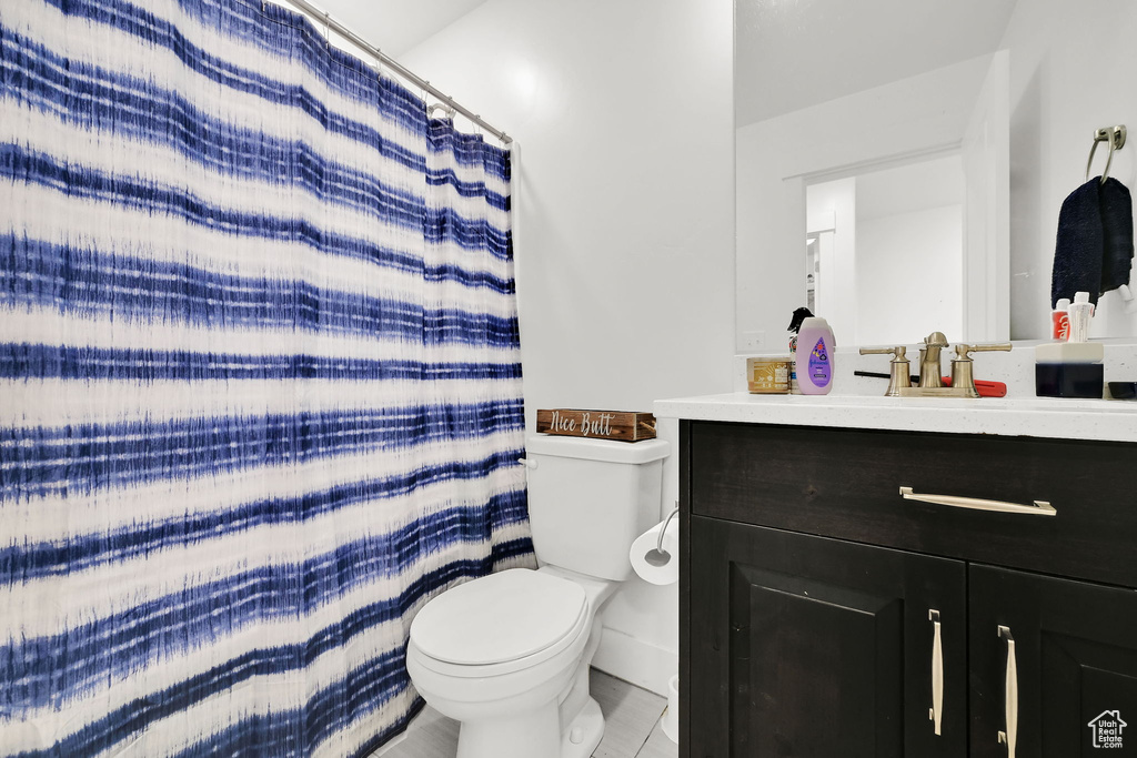 Bathroom with toilet and vanity