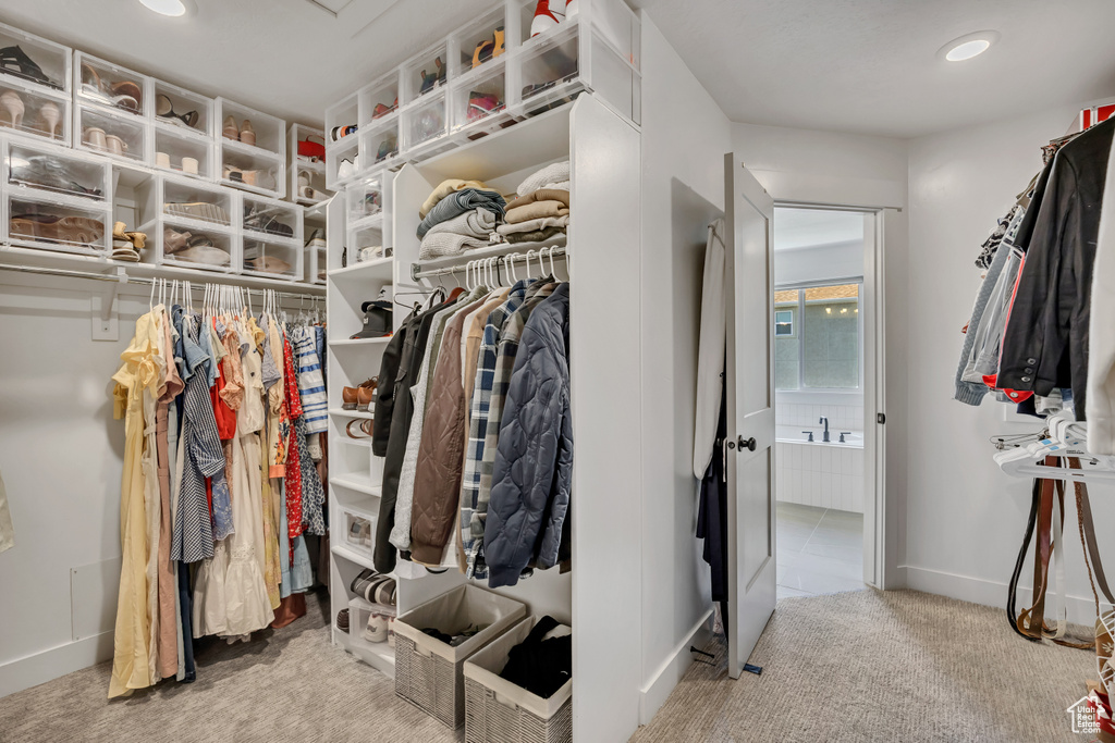 Spacious closet with carpet flooring
