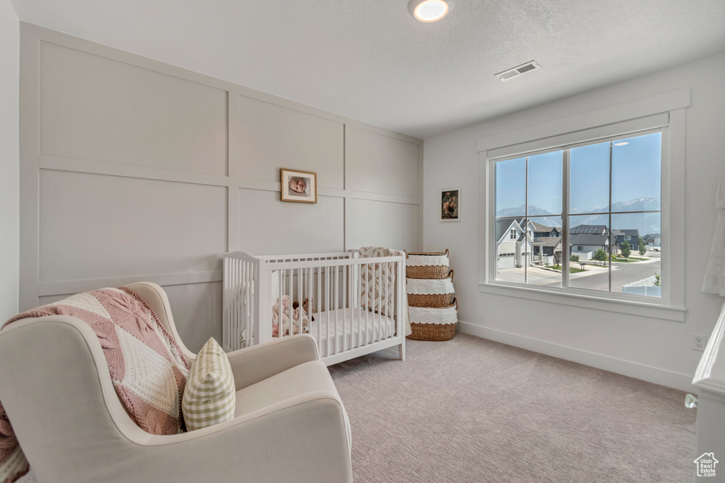 Bedroom with carpet and baseboards