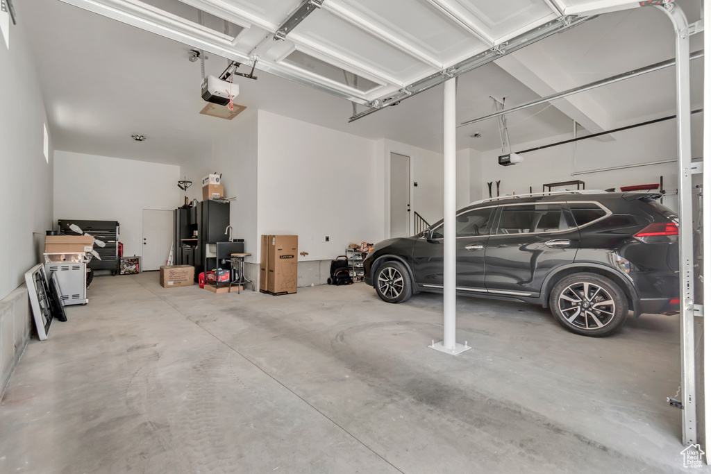 Garage featuring a garage door opener