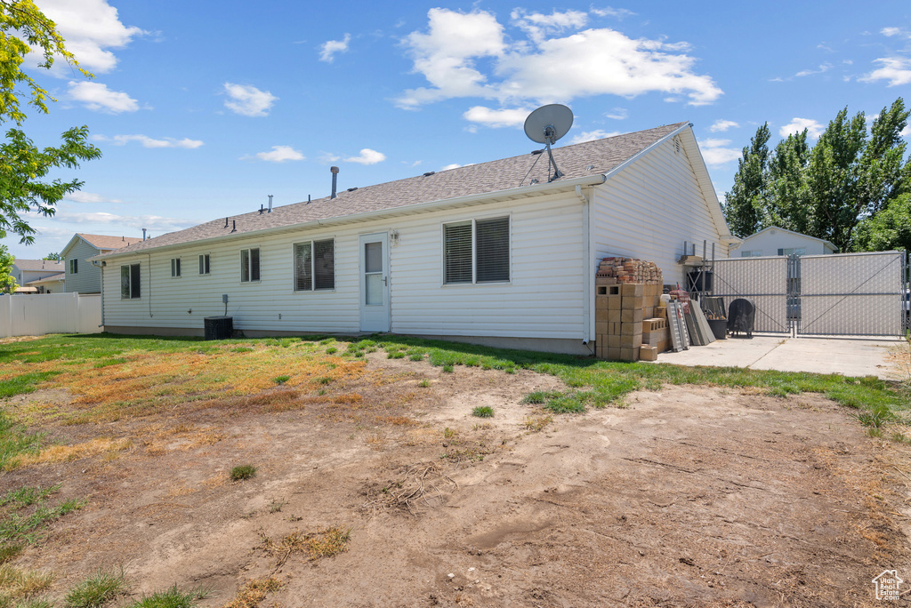 Rear view of house with a gate