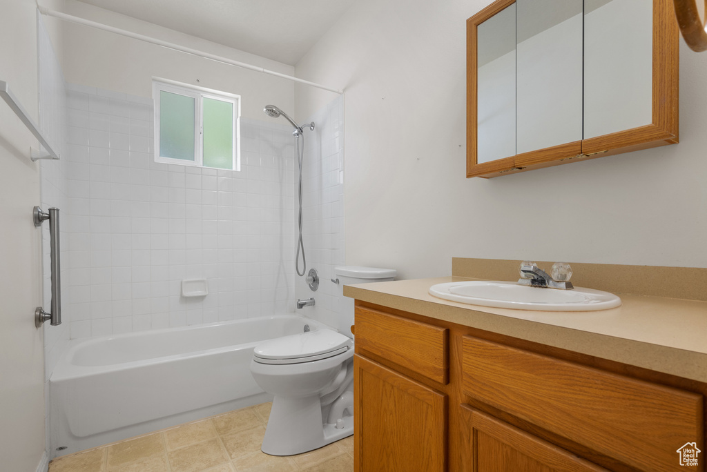 Bathroom featuring tub / shower combination and vanity