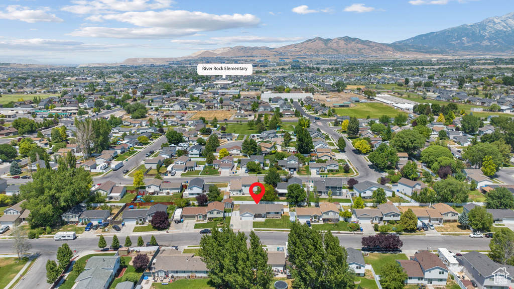 View of property location with mountains and nearby suburban area