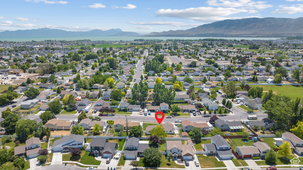 Aerial perspective of suburban area with a mountain backdrop