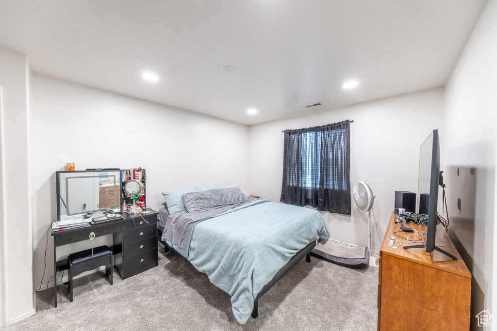 Bedroom with carpet floors, an office area, and recessed lighting