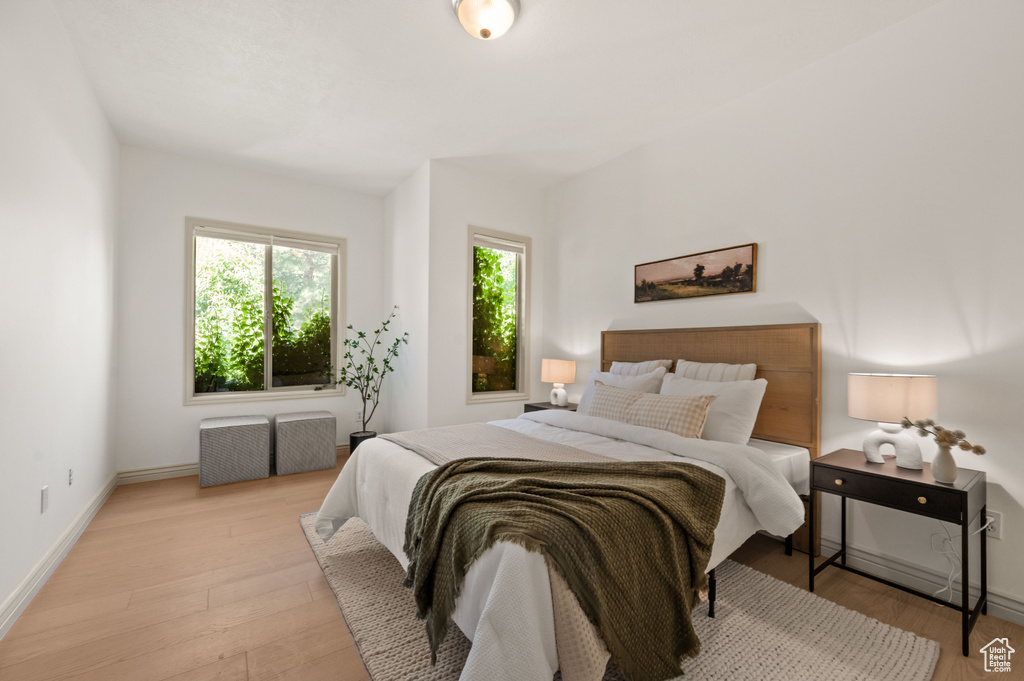 Bedroom featuring light wood finished floors and baseboards