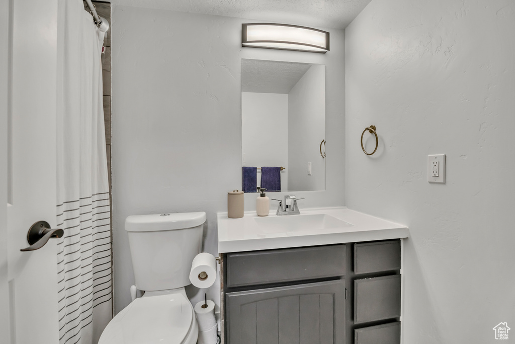 Bathroom with vanity and a shower with shower curtain