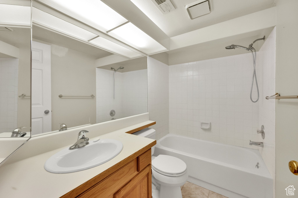 Full bathroom with vanity, shower / washtub combination, and tile patterned floors