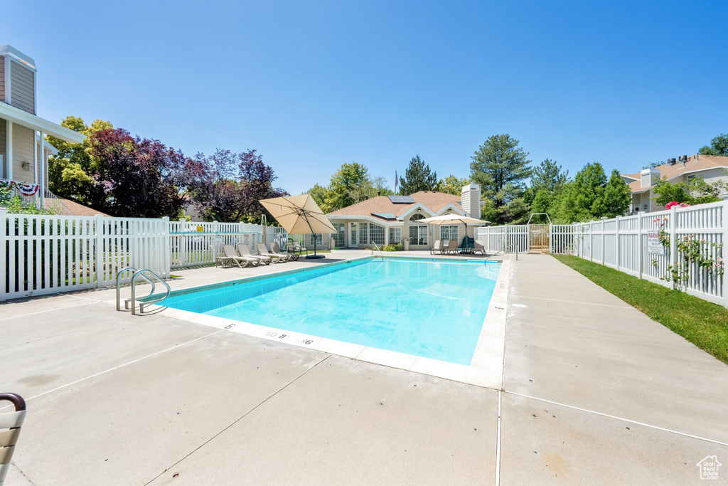 Community pool featuring a patio