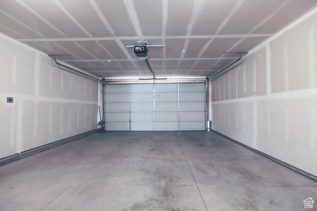 Garage featuring a garage door opener