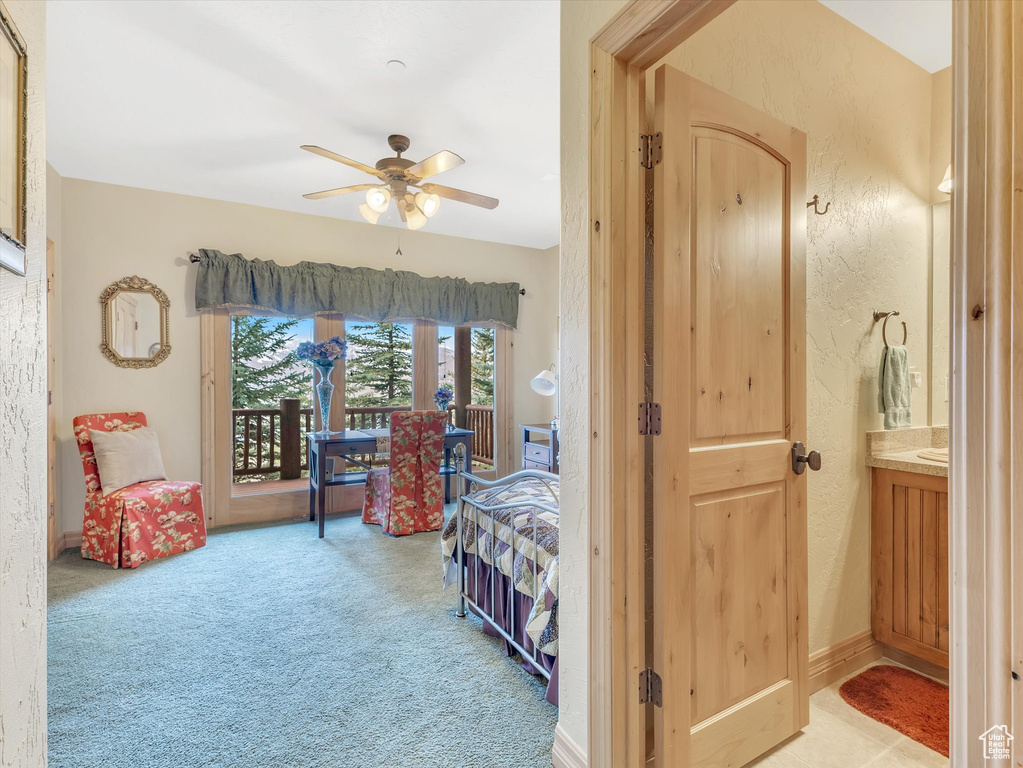 Bedroom with carpet, french doors, access to exterior, and ceiling fan